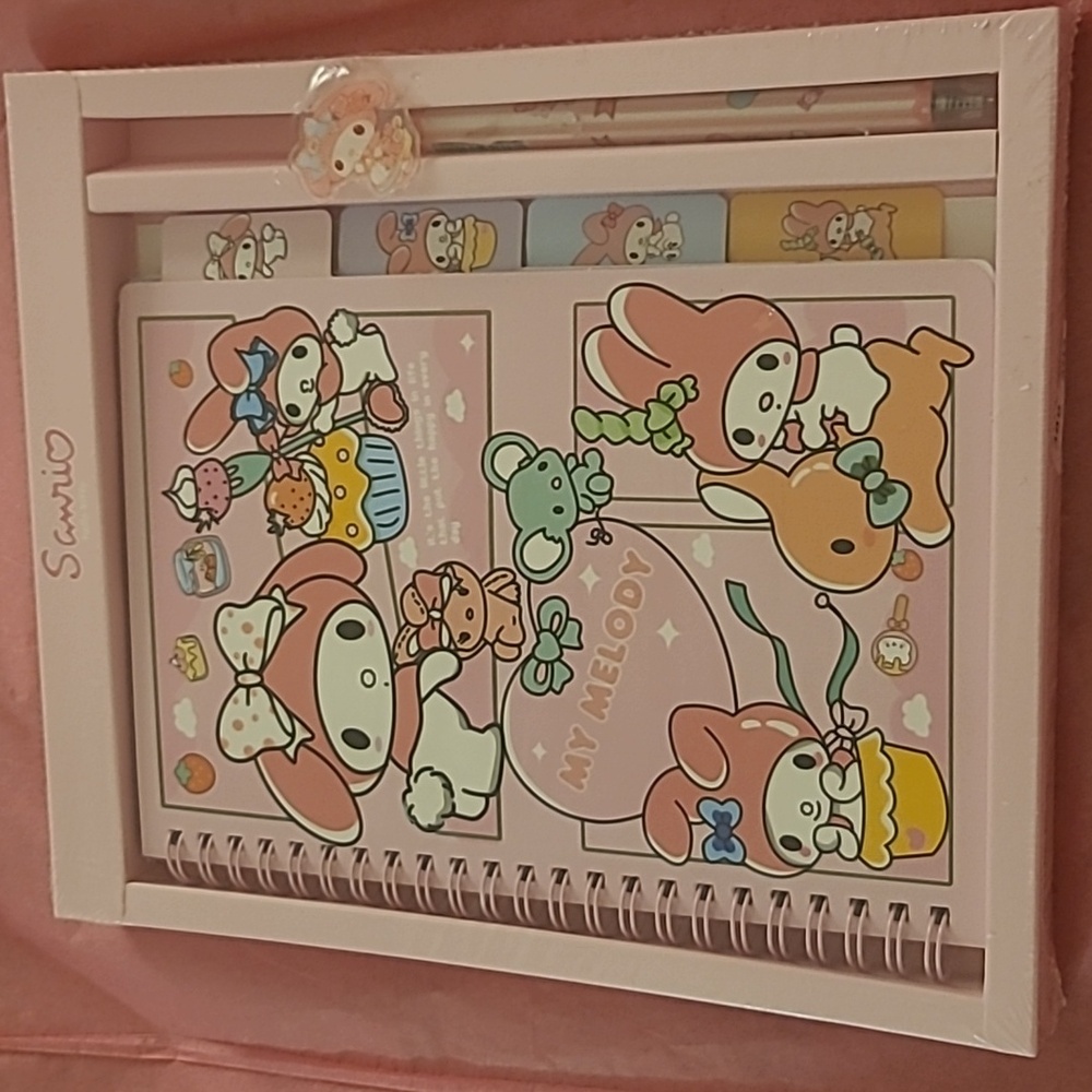 Sanrio, my melody notebook with a pen